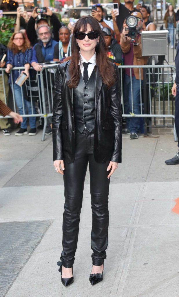 Anne Hathaway in a Black Leather Suit