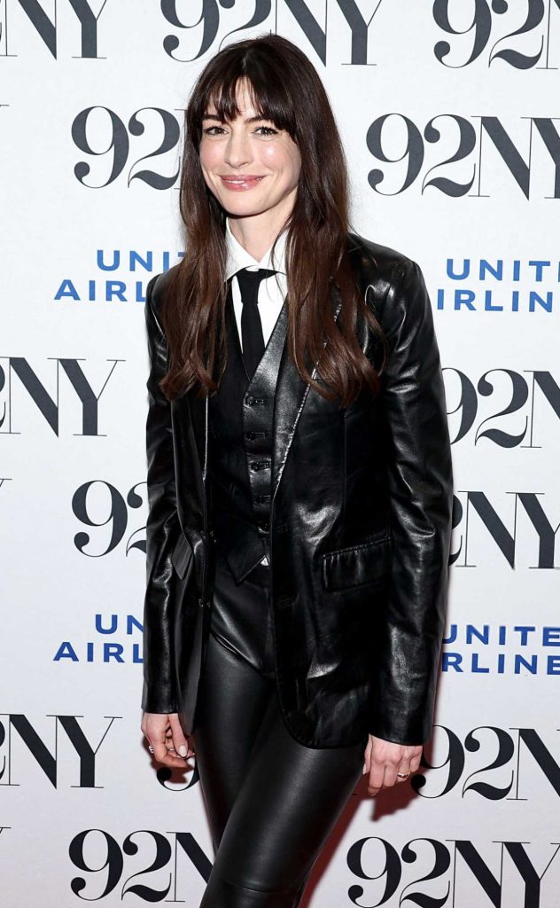 Anne Hathaway in a Black Leather Suit