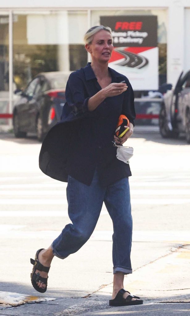 Charlize Theron in a Blue Shirt