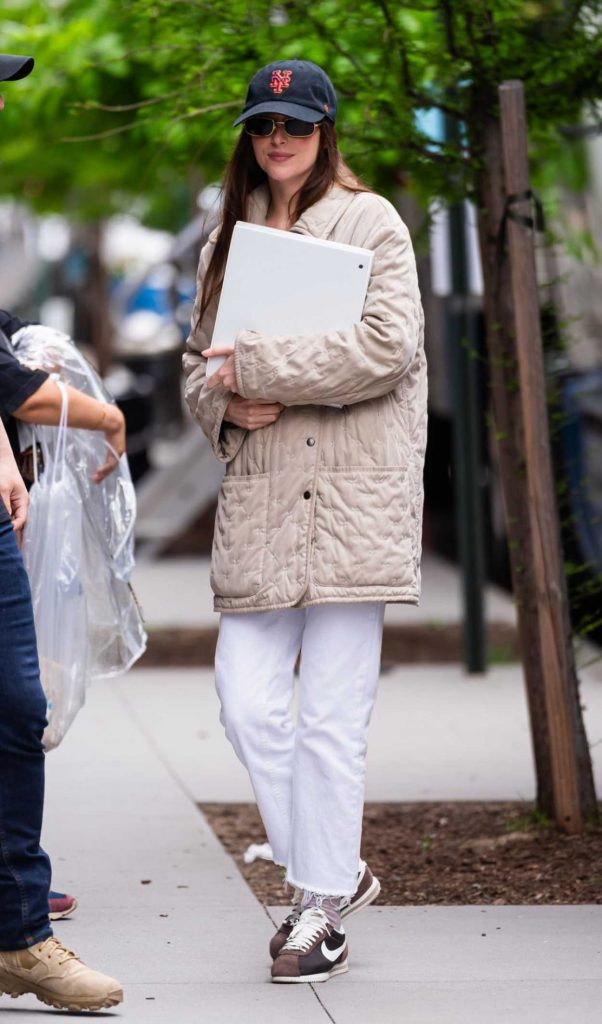 Dakota Johnson in a Black Cap