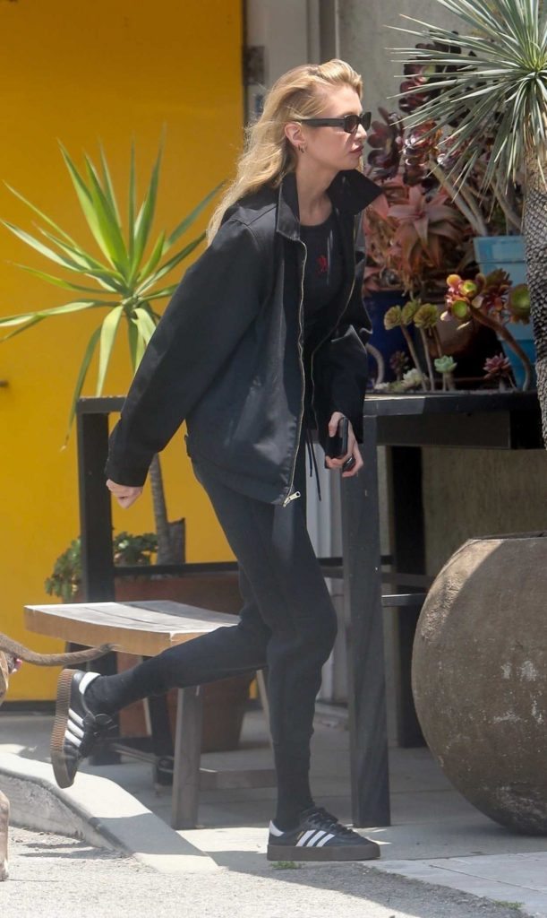 Stella Maxwell in a Black Adidas Sneakers