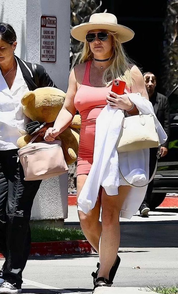 Britney Spears in a Form Fitting Red Mini Dress