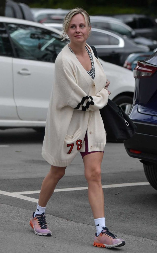 Tina O'Brien in a White Cardigan