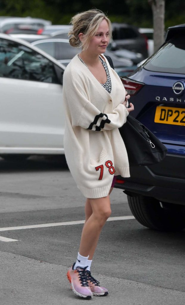 Tina O'Brien in a White Cardigan