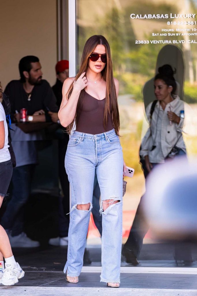 Khloe Kardashian in a Blue Ripped Jeans