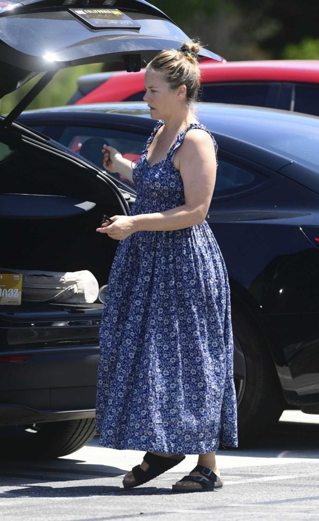 Alicia Silverstone in a Blue Floral Dress