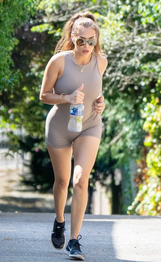 Chloe Goodman in a Beige Catsuit