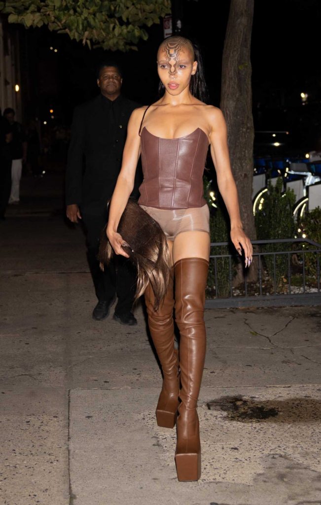 FKA Twigs in a Brown Over The Knee Boots