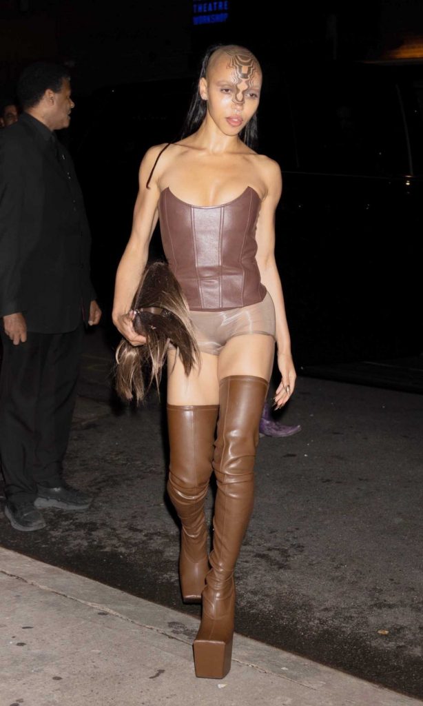 FKA Twigs in a Brown Over The Knee Boots