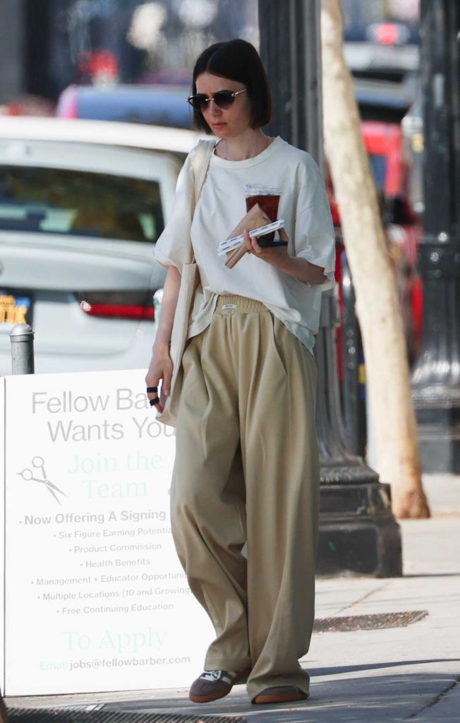 Lily Collins in a Beige Sweatpants