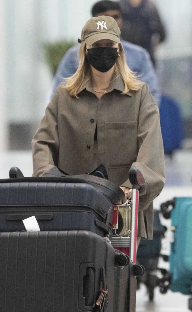 Margot Robbie in a Black Protective Mask