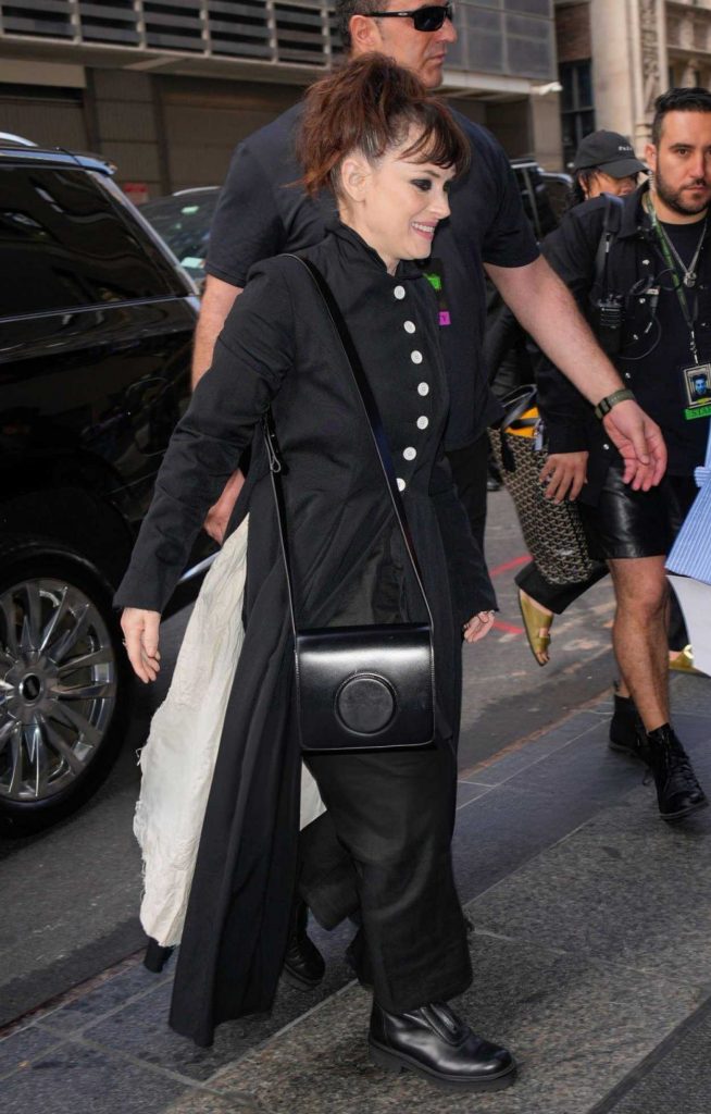 Winona Ryder in a Black Trench Coat