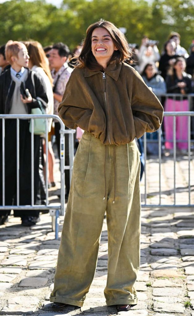 Emma Mackey in a Brown Jacket