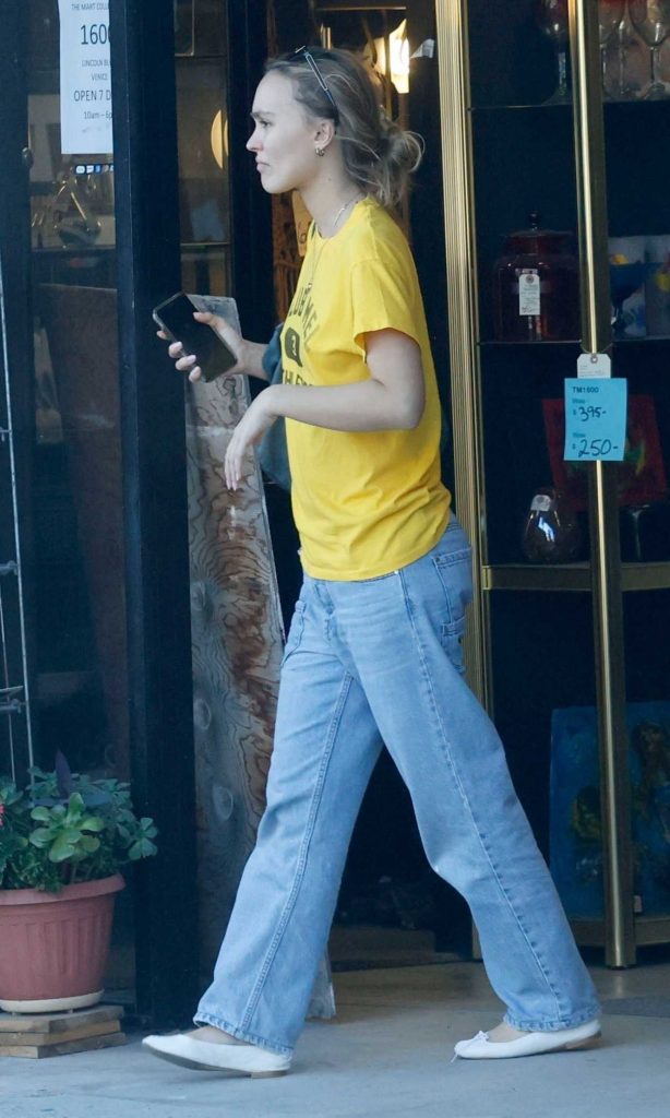 Lily-Rose Depp in a Yellow Tee