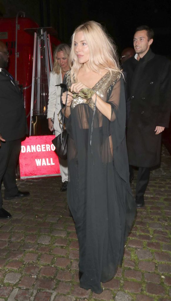 Sienna Miller in a Black See-Through Dress