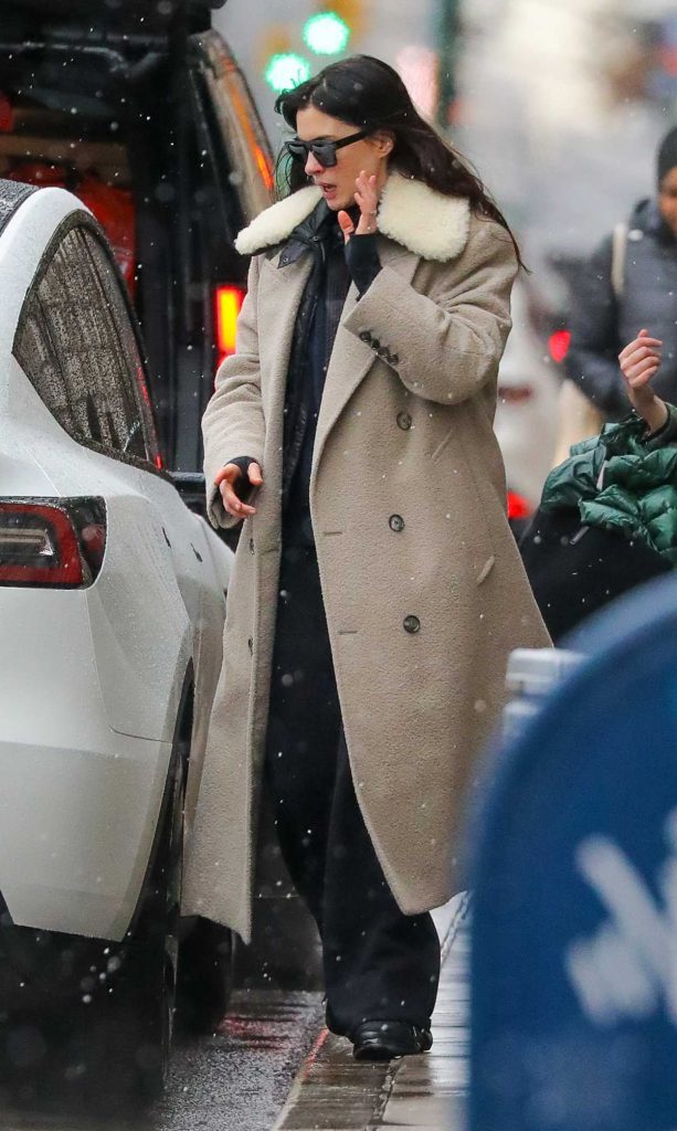 Anne Hathaway in a Beige Coat