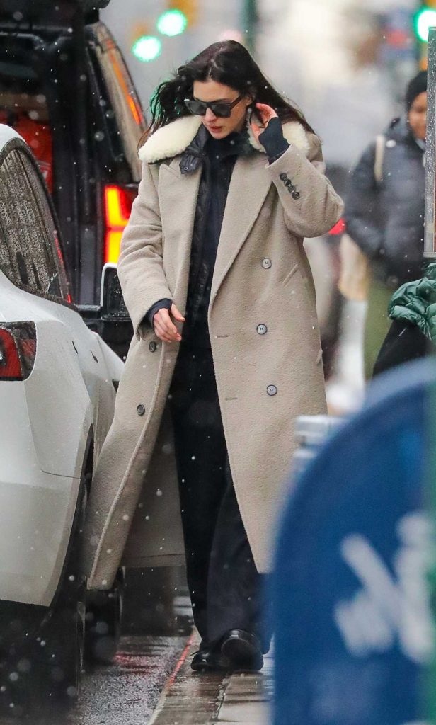 Anne Hathaway in a Beige Coat