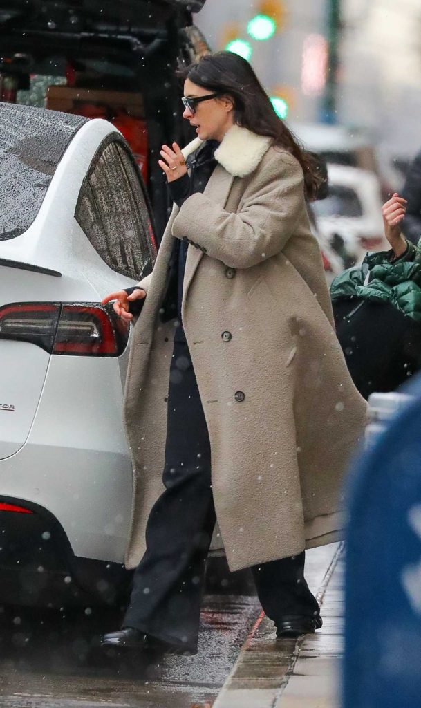 Anne Hathaway in a Beige Coat