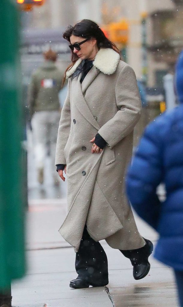 Anne Hathaway in a Beige Coat