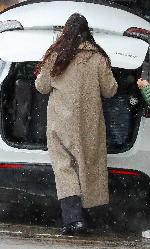 Anne Hathaway in a Beige Coat