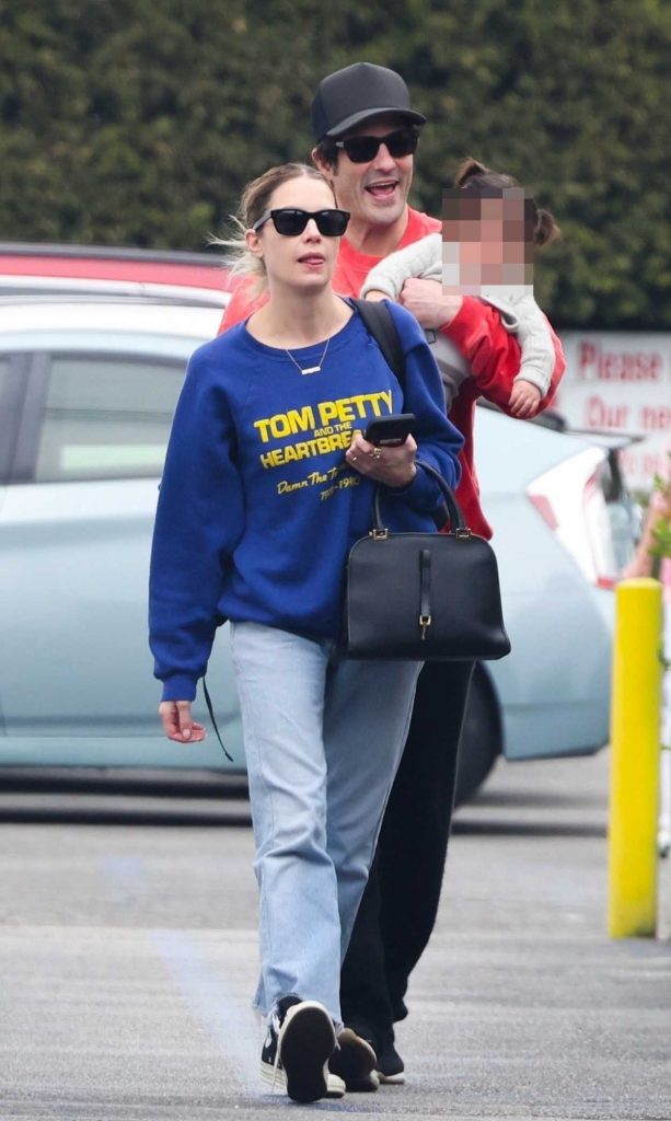 Ashley Benson in a Blue Sweatshirt