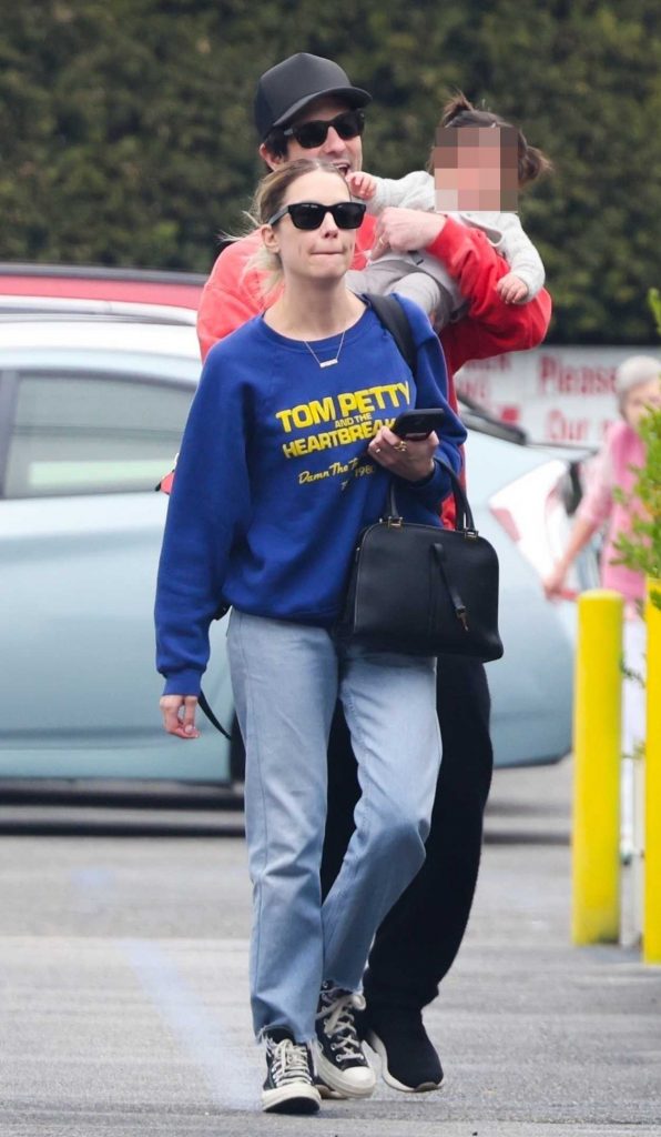 Ashley Benson in a Blue Sweatshirt