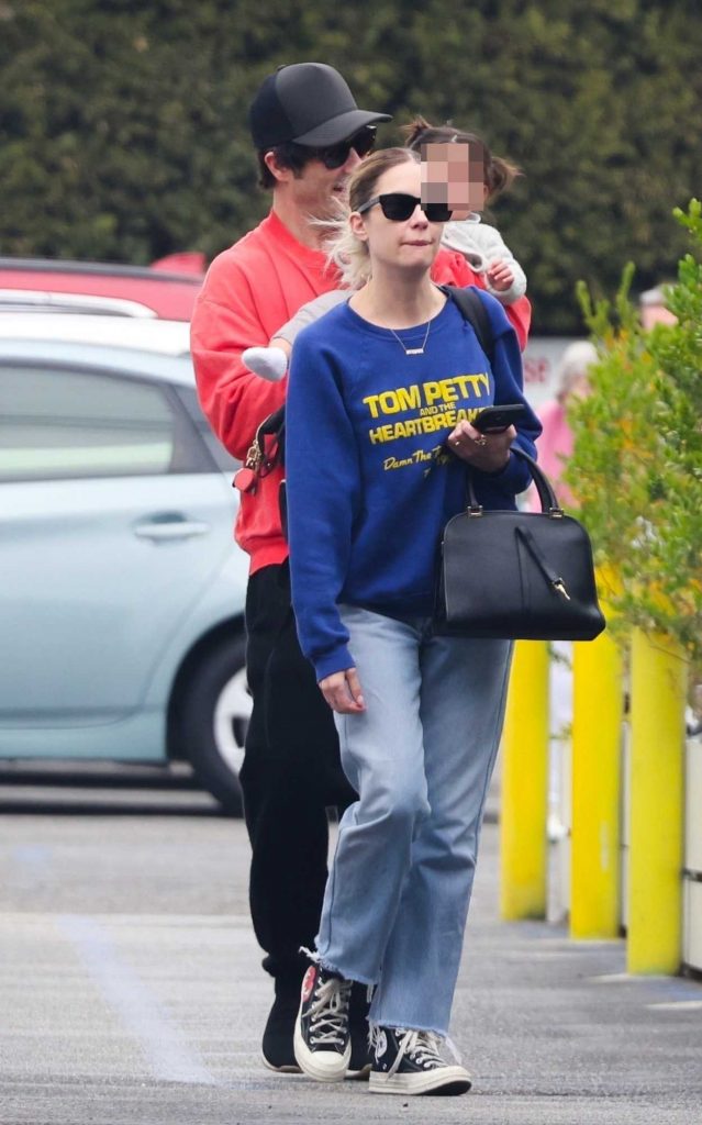 Ashley Benson in a Blue Sweatshirt