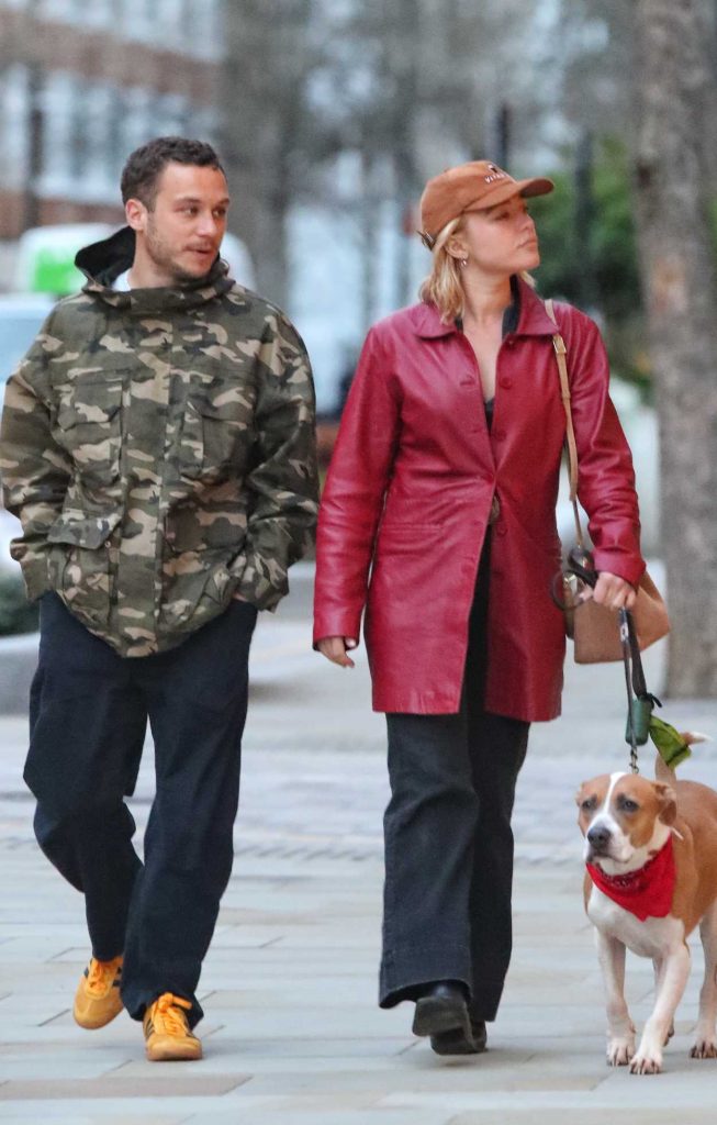 Florence Pugh in a Red Leather Trench Coat