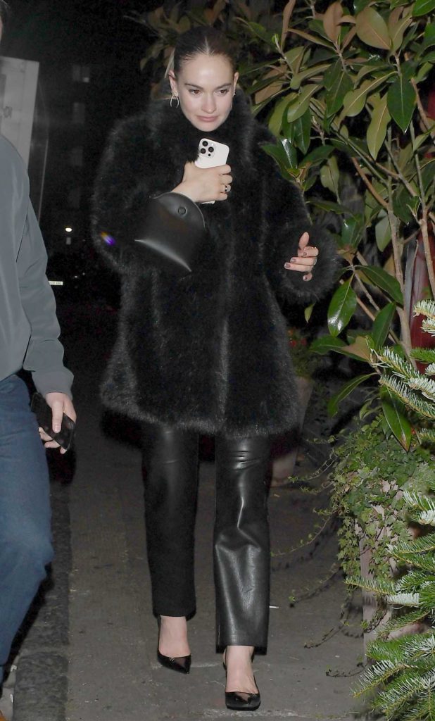 Lily James in a Black Fur Coat