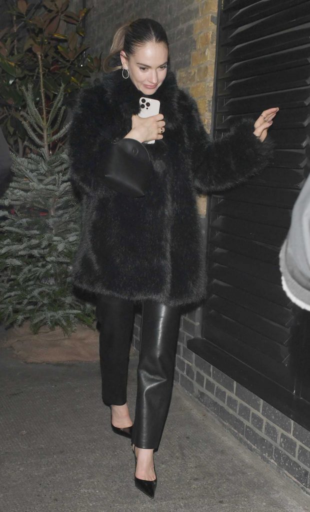 Lily James in a Black Fur Coat