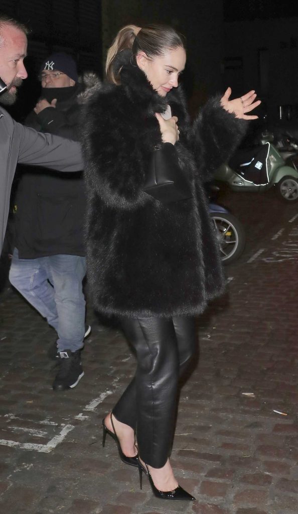 Lily James in a Black Fur Coat