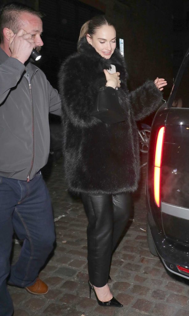 Lily James in a Black Fur Coat