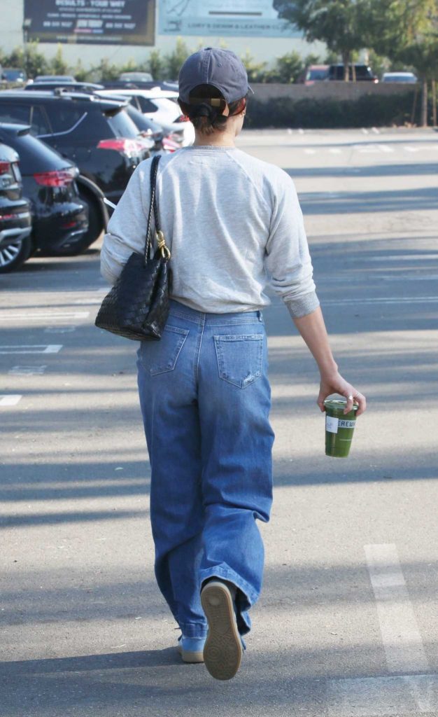 Lucy Hale in a Blue Cap