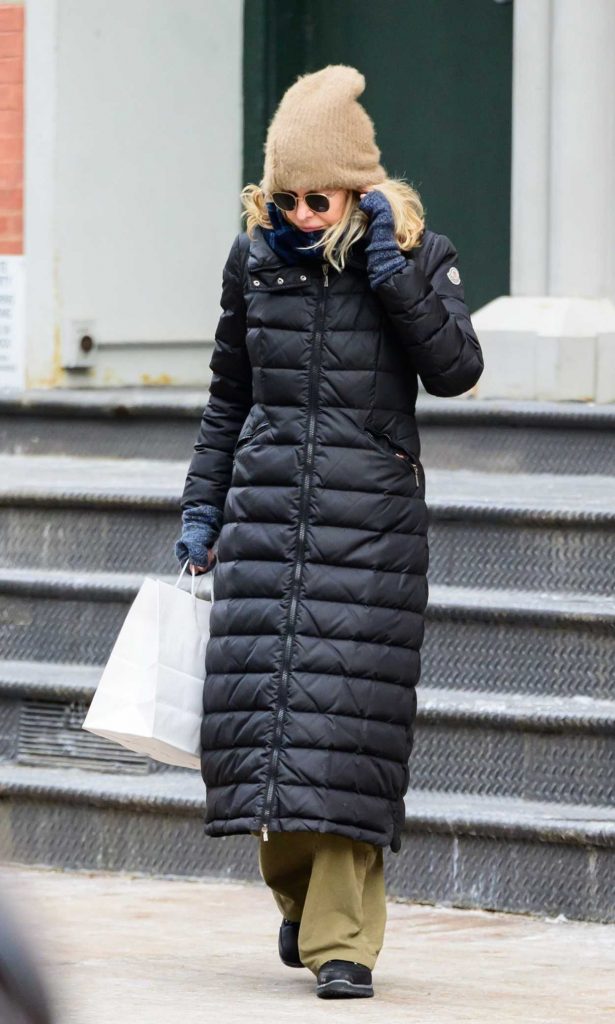 Meg Ryan in a Black Puffer Coat