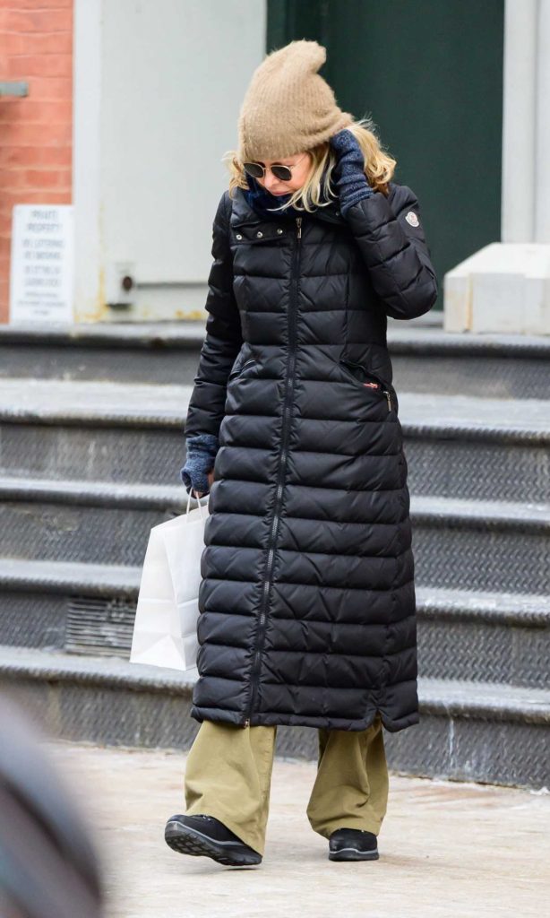 Meg Ryan in a Black Puffer Coat