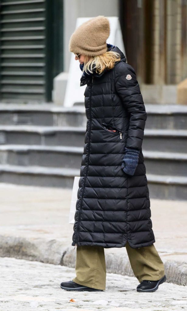 Meg Ryan in a Black Puffer Coat