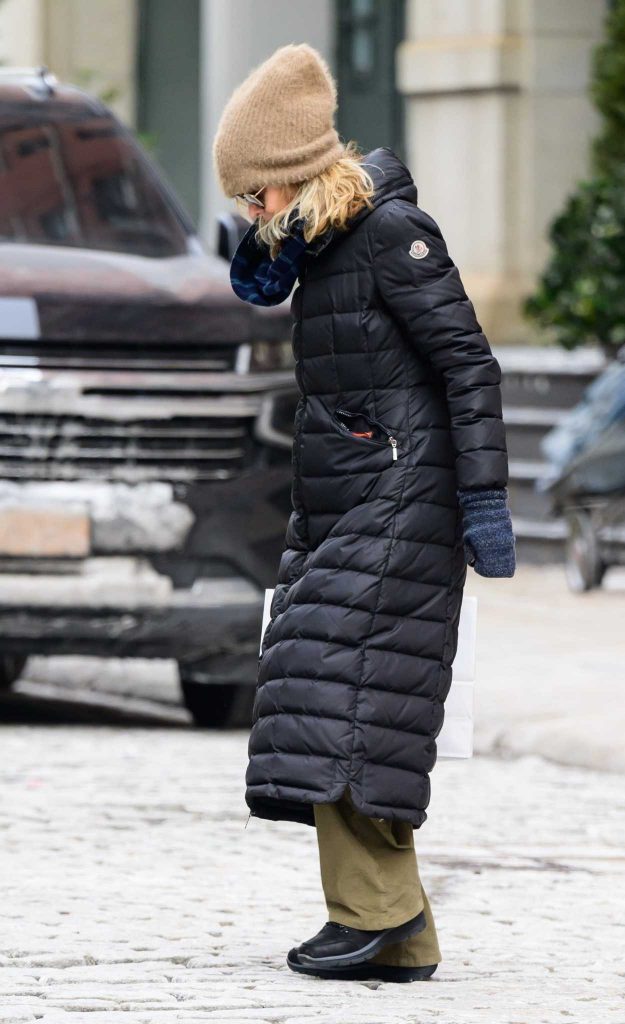 Meg Ryan in a Black Puffer Coat