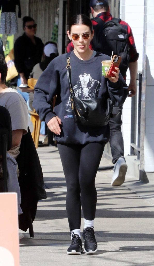 Lucy Hale in a Black Sneakers