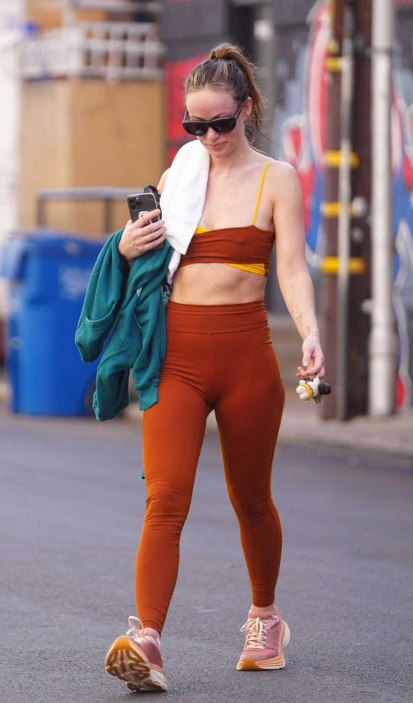 Olivia Wilde in an Orange Workout Ensemble