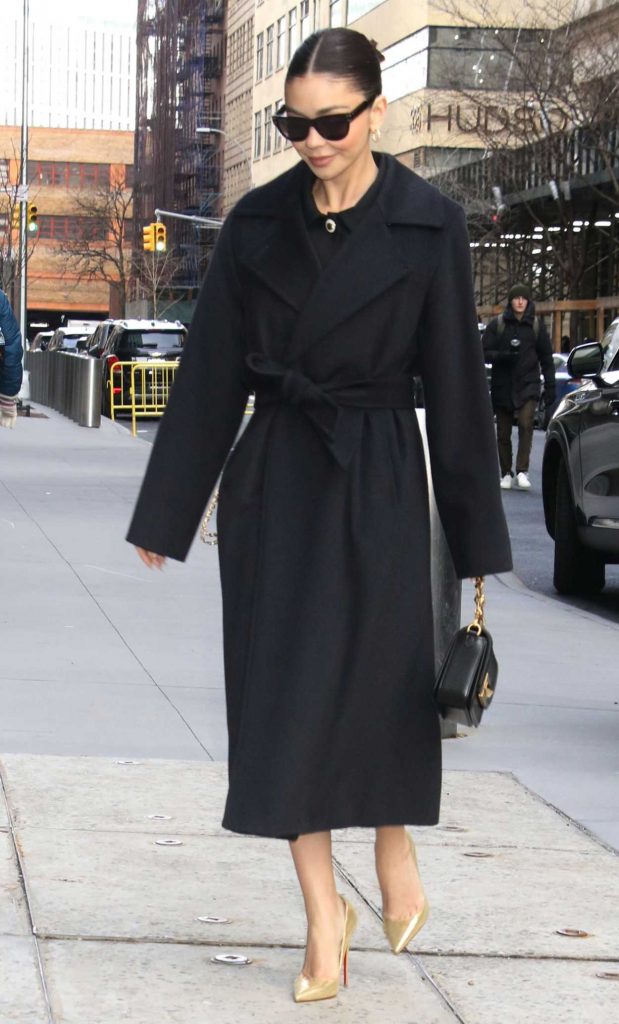 Sarah Hyland in a Black Coat