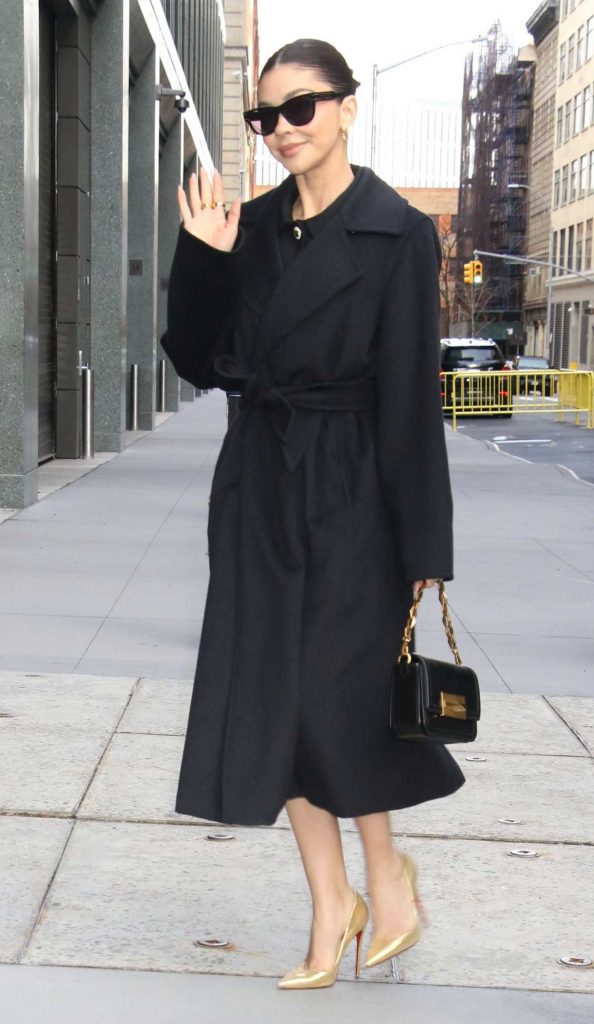 Sarah Hyland in a Black Coat