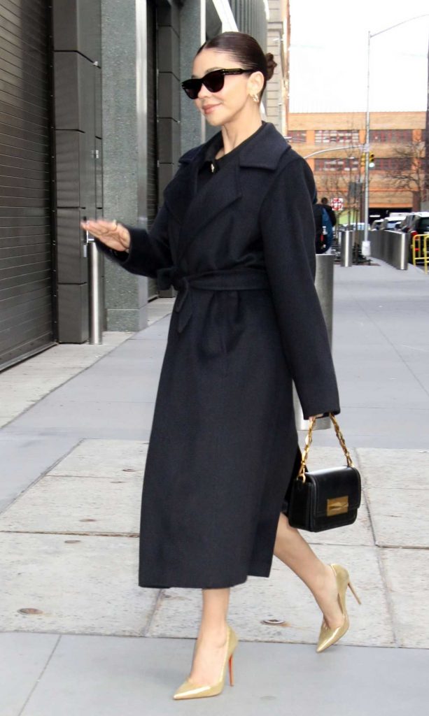 Sarah Hyland in a Black Coat