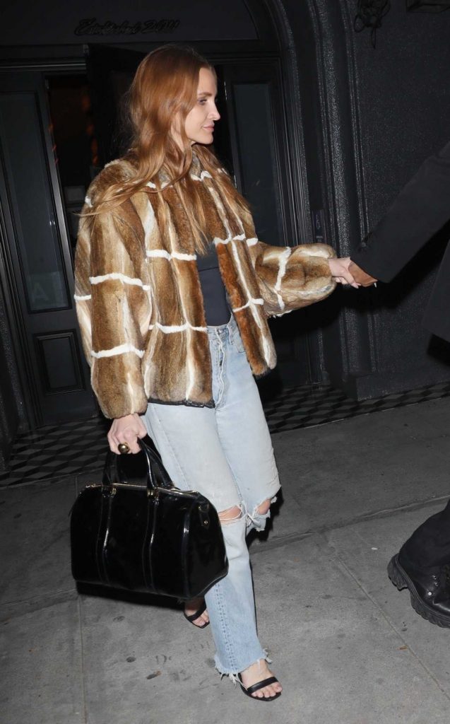 Ashlee Simpson in a Blue Ripped Jeans