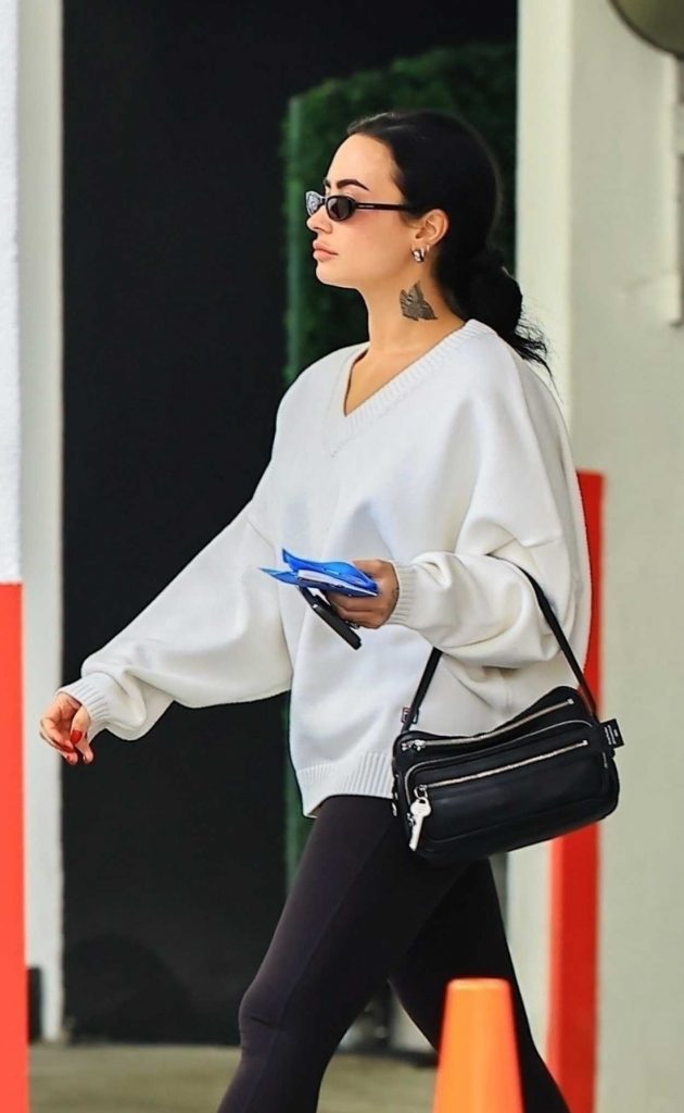 Demi Lovato in a White Nike Sneakers