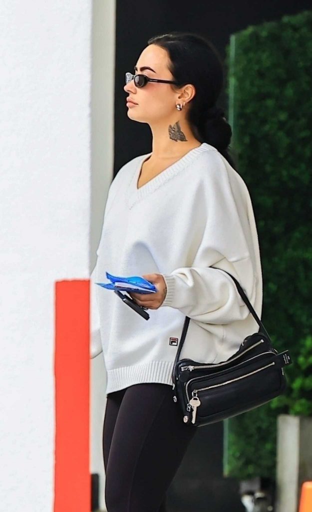 Demi Lovato in a White Nike Sneakers