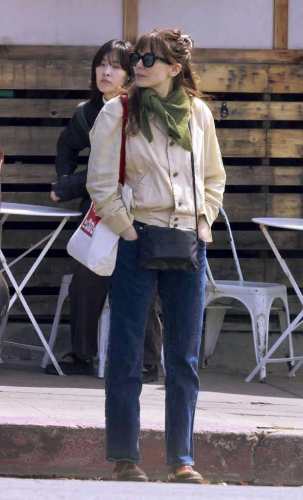 Elizabeth Olsen in a Beige Jacket