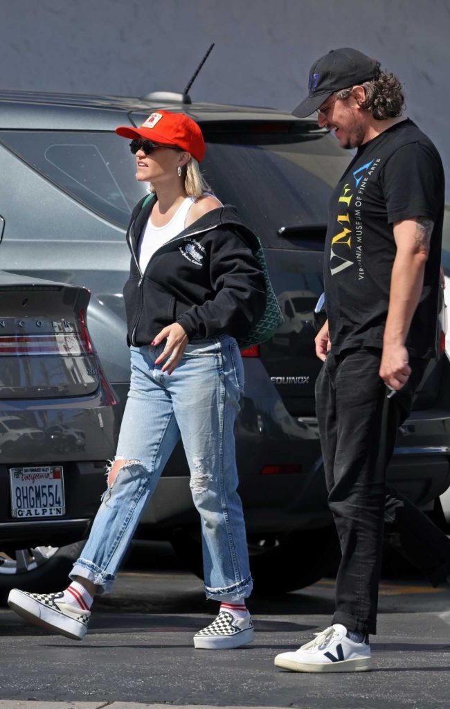 Emily Osment in an Orange Cap