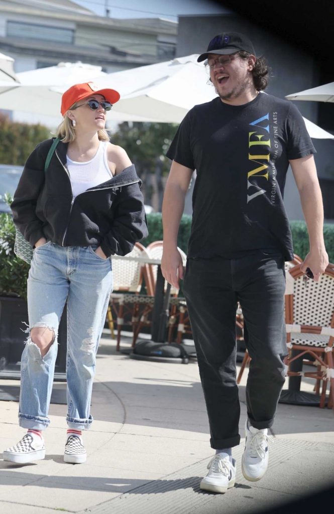 Emily Osment in an Orange Cap