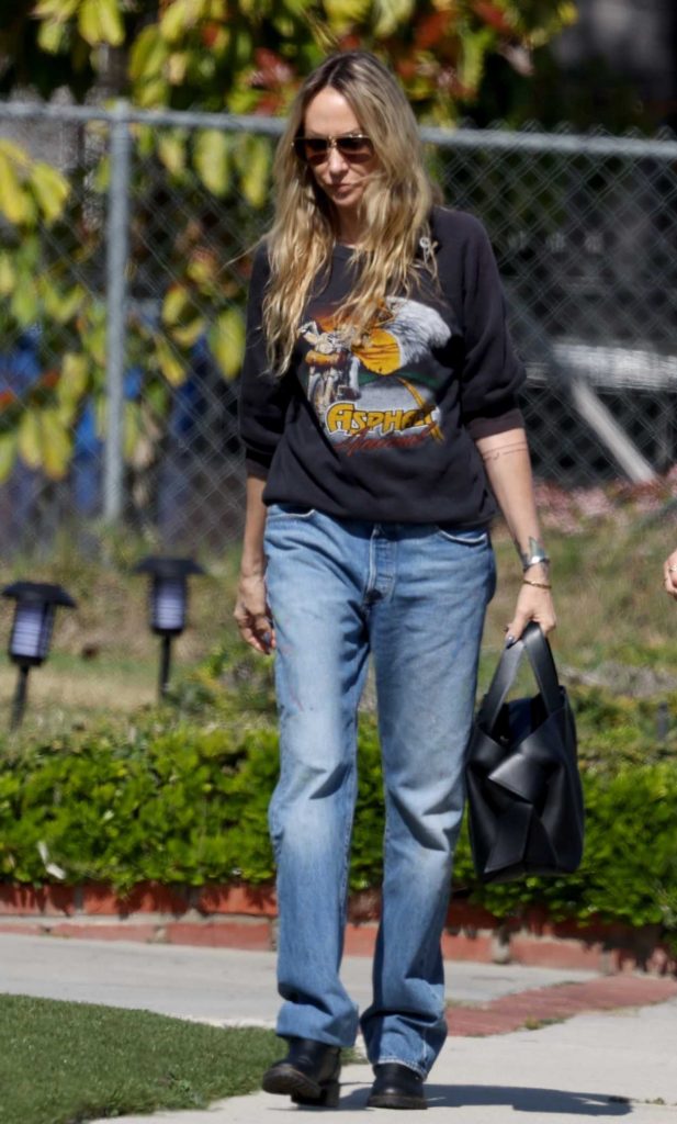 Tish Cyrus in a Black Sweatshirt