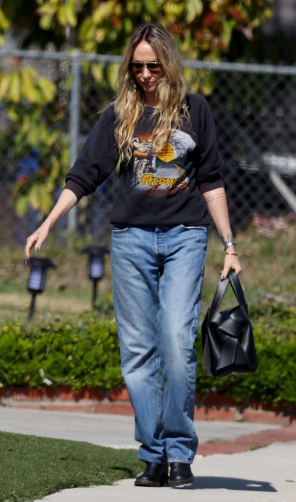 Tish Cyrus in a Black Sweatshirt